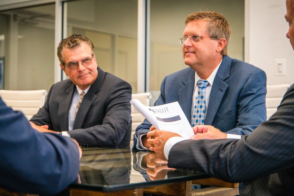 Vallit advisors discussing business valuation, dispute consulting and forensic accounting services